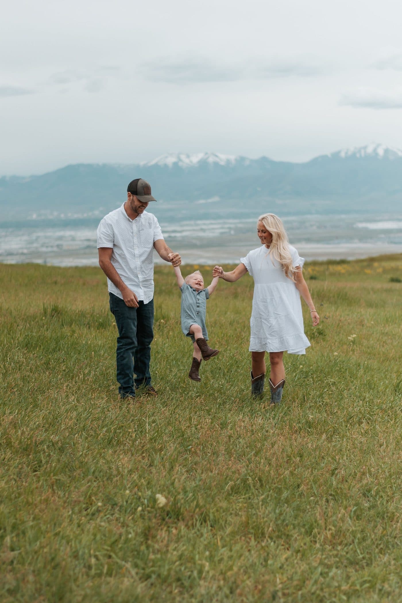 The Pure & Delicious founders walking through a field with their little one
